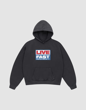 The LIVE FAST DIE YOUNG Live Fast Box Hooded is a black hoodie with a front pocket and bold "LIVE FAST" graphic in red, white, and blue. Made from Baumwolle Polyester for comfort and durability. | plain