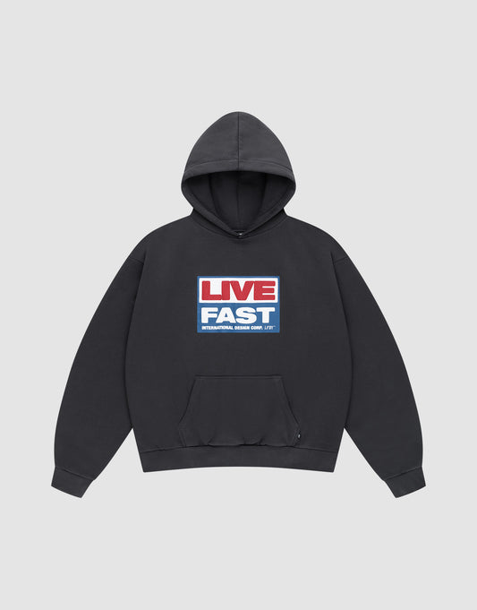 The LIVE FAST DIE YOUNG Live Fast Box Hooded is a black hoodie with a front pocket and bold "LIVE FAST" graphic in red, white, and blue. Made from Baumwolle Polyester for comfort and durability. | plain