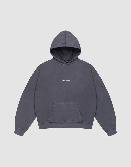 The LFDY Core Hooded by LIVE FAST DIE YOUNG is an oversized dark gray hoodie with a front "LIVE FAST" print in small white letters, 100% Baumwolle, front pocket, shown on a plain light gray background. | plain