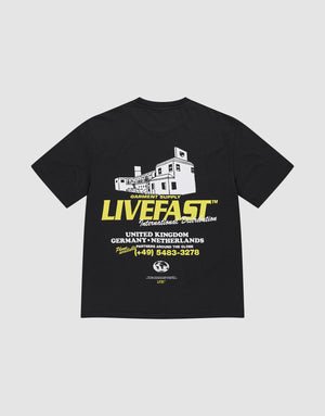 The LFDY Supply Tee by LIVE FAST DIE YOUNG is an oversized black T-shirt featuring a building front print, bold yellow LIVE FAST™ text, and white/yellow supply details. Made from 100% Baumwolle. | plain