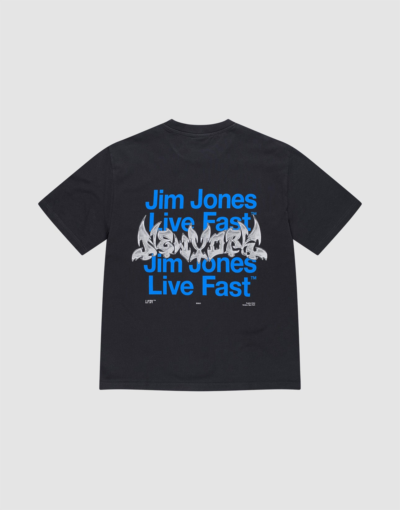 The LIVE FAST DIE YOUNG "Live Fast NY Tee" is an oversize-fit black cotton T-shirt featuring blue "Jim Jones Live Fast" text repeated twice and a white graffiti-style front print. The shirt is displayed flat on a light gray background. | plain