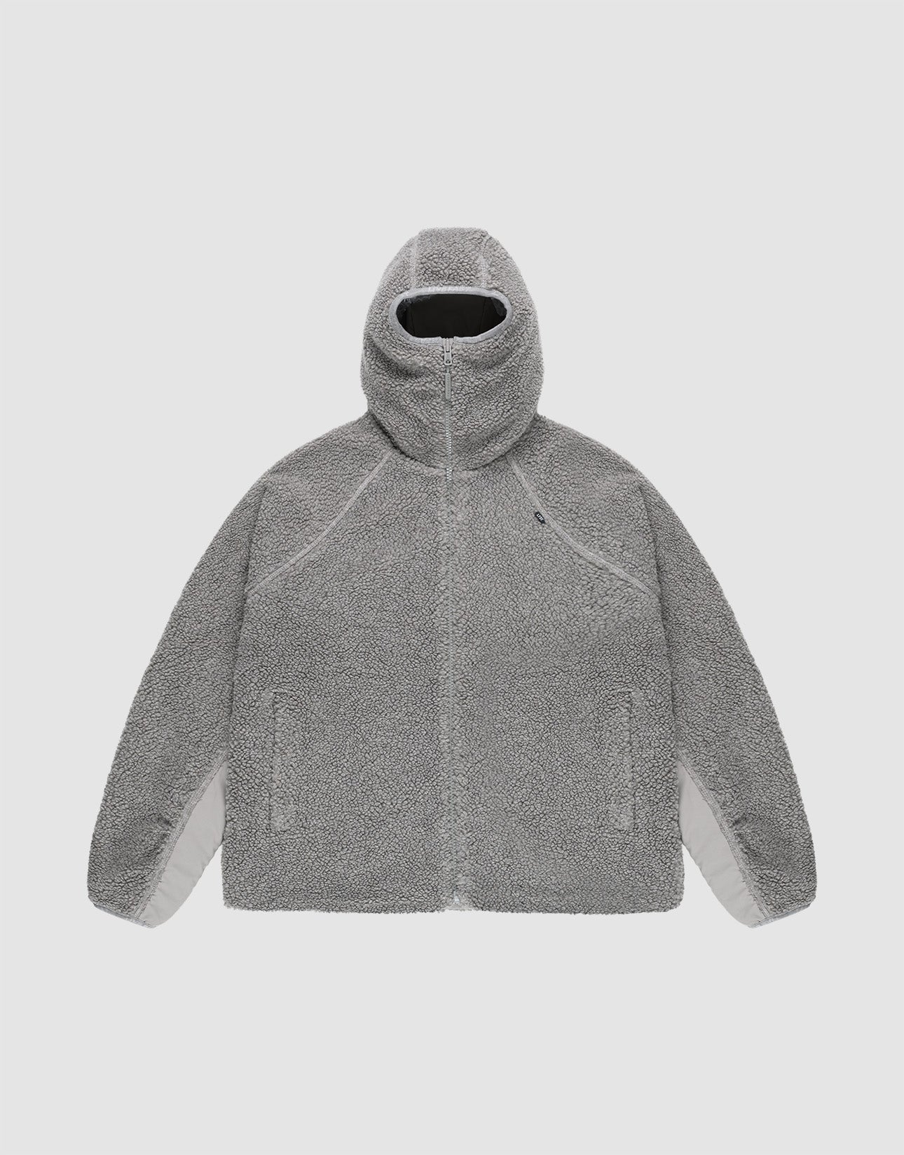 The LIVE FAST DIE YOUNG Live Fast Teddy Jacket is a gray, oversize-fit Kapuzenjacke with a high collar, zip-up front, raglan sleeves, and two side pockets, shown flat on a plain light background.
