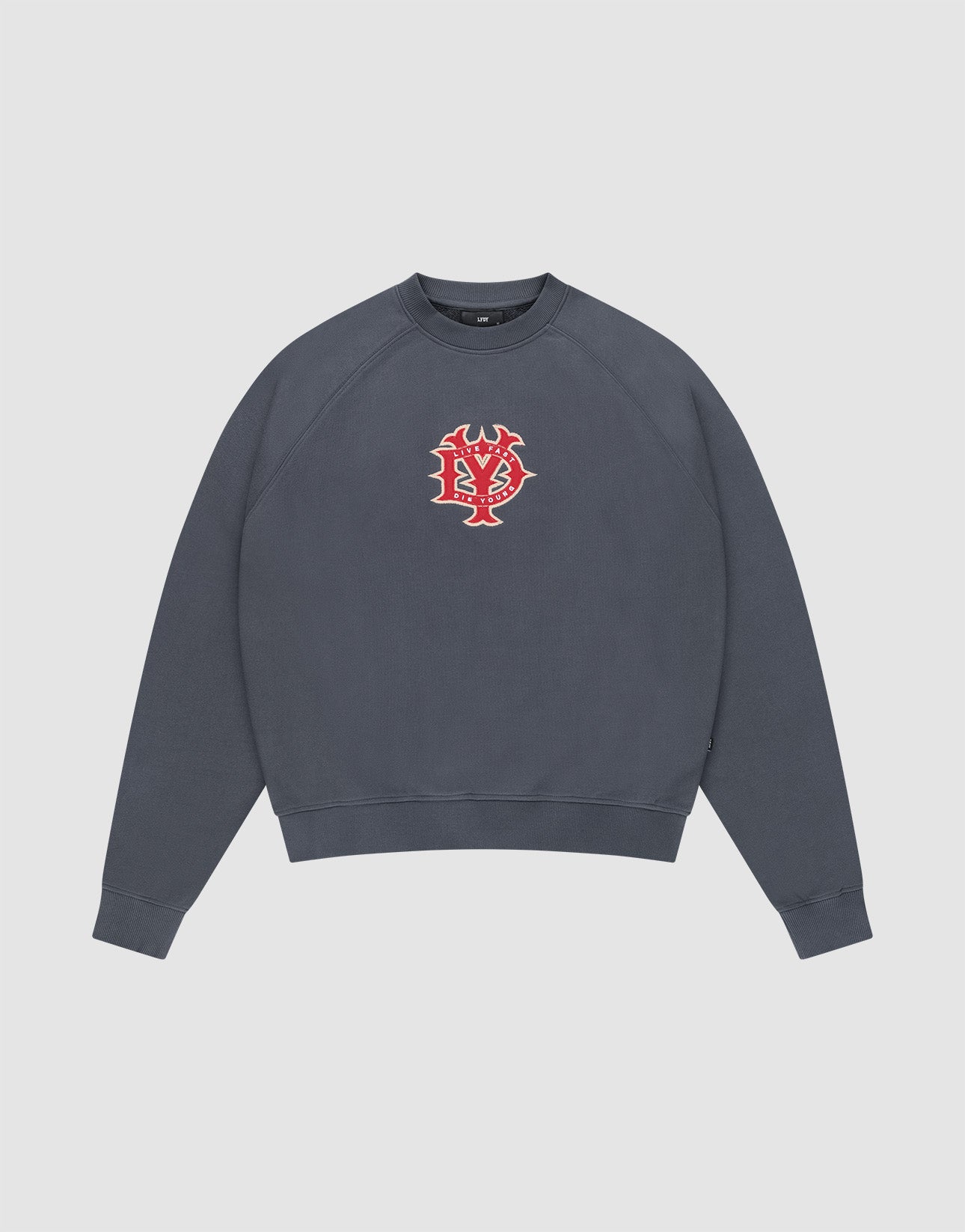 The DY Sweater by LIVE FAST DIE YOUNG is a dark gray crewneck with Raglan sleeves and a red and white abstract face graphic on the chest, shown against a plain white background. | plain