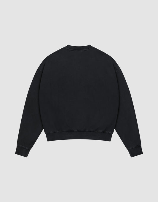The LFDY Hardwear Sweater by LIVE FAST DIE YOUNG, a plain black oversized crewneck, is displayed from the back, laid flat on a light grey background.