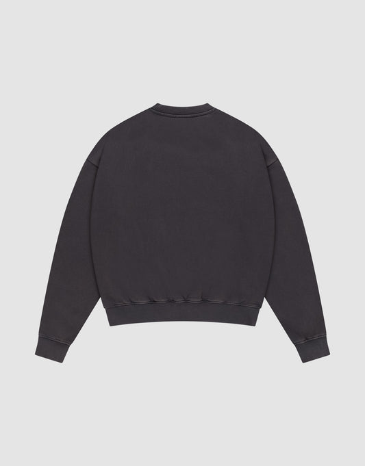 The Live Fast DY Sweater by LIVE FAST DIE YOUNG is a plain black crewneck, shown from the back on a white background with long sleeves, ribbed cuffs and hem, and a relaxed oversize fit for modern comfort.