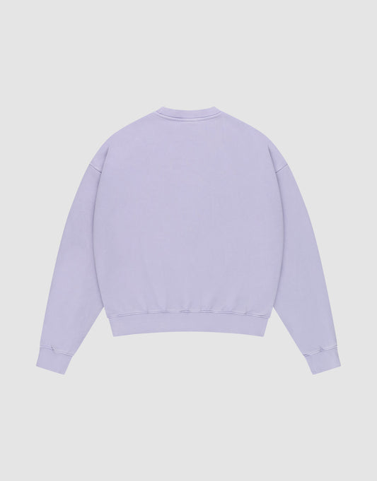 The LIVE FAST DIE YOUNG Triple Sweater, a plain light purple cotton sweatshirt with long sleeves, ribbed cuffs, and waistband, is shown flat from the back against a white background.
