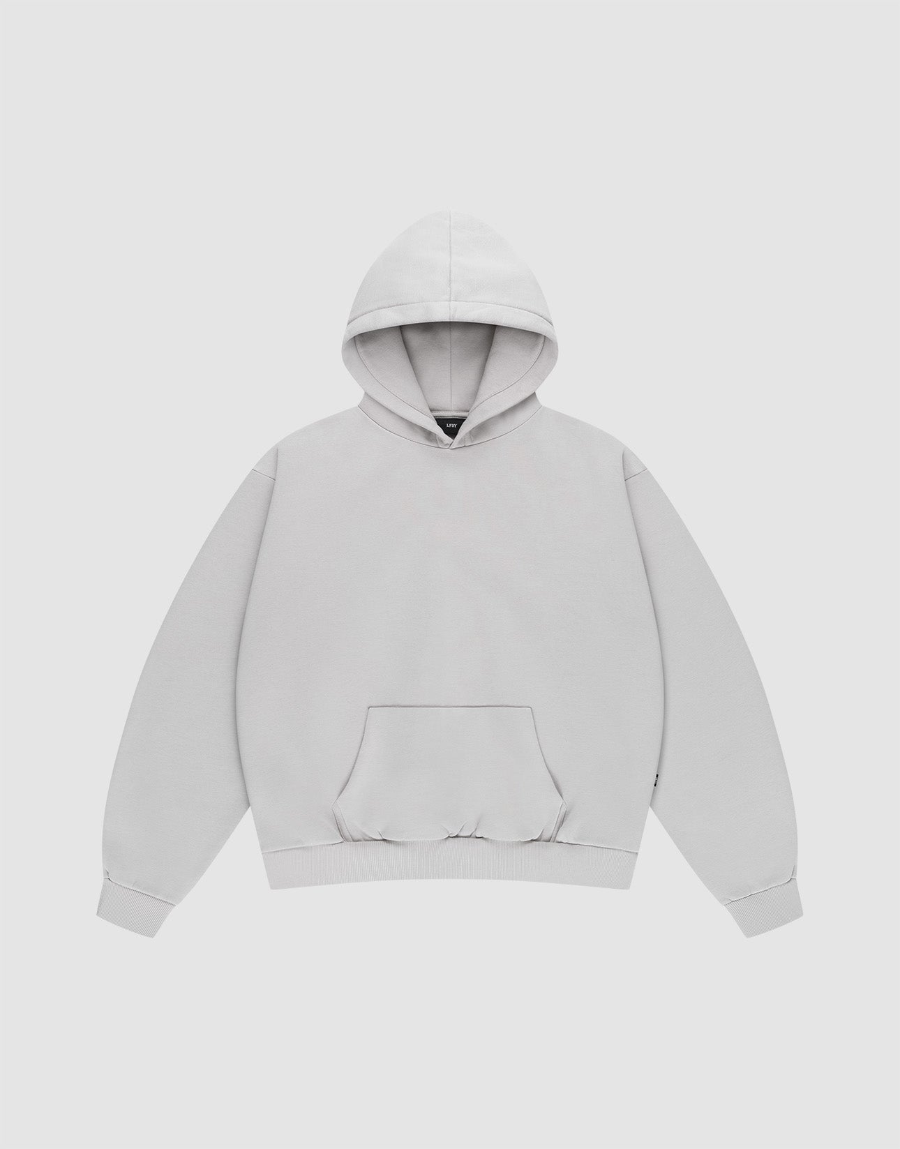 The LIVE FAST DIE YOUNG Basic Blank Hooded is an oversized light gray hoodie made from soft Baumwolle, featuring a front pouch pocket, long sleeves, ribbed cuffs and hem, and neat topstitching—displayed on a white background. | plain