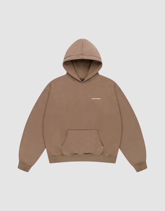The Live Fast Plain Hooded by LIVE FAST DIE YOUNG is a brown oversized sweatshirt with a front pocket and small white “LUF FIRST” print on the left chest, made from soft Baumwolle and shown on a light gray background. | plain