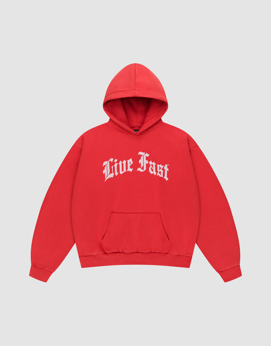 The LIVE FAST DIE YOUNG Live Fast Fractured Hooded is a red oversized hoodie with a doppellagige Kapuze, front pouch pocket, and bold white Old English "Live Fast" print. Made from soft cotton-polyester blend. Shown on a plain light gray background. | plain