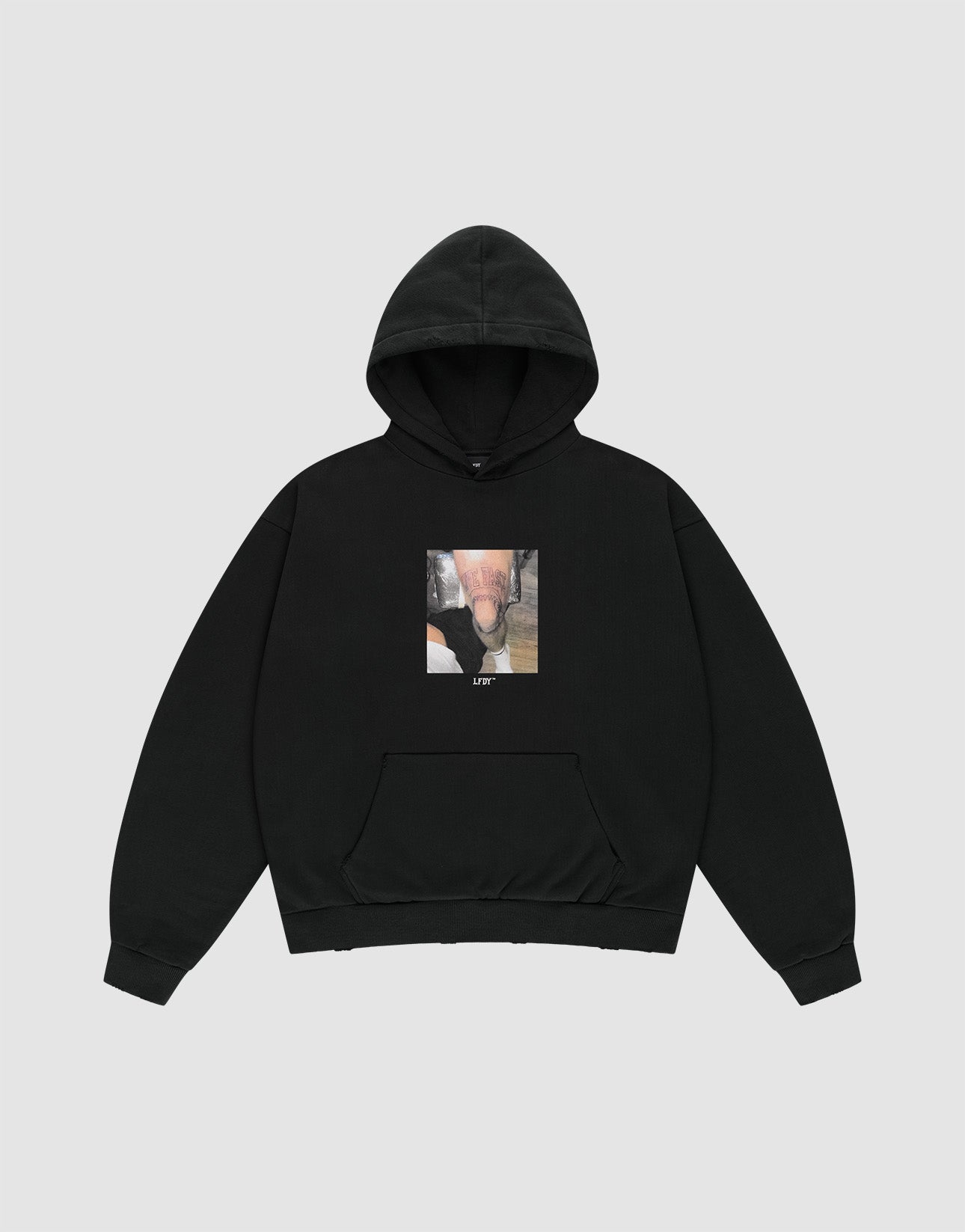 The LFDY Sharkhunter Hooded by LIVE FAST DIE YOUNG is a black oversized hoodie made from soft Baumwolle, featuring front and back prints, a pouch pocket, and a centered graphic with "LIFE" on the chest. | plain