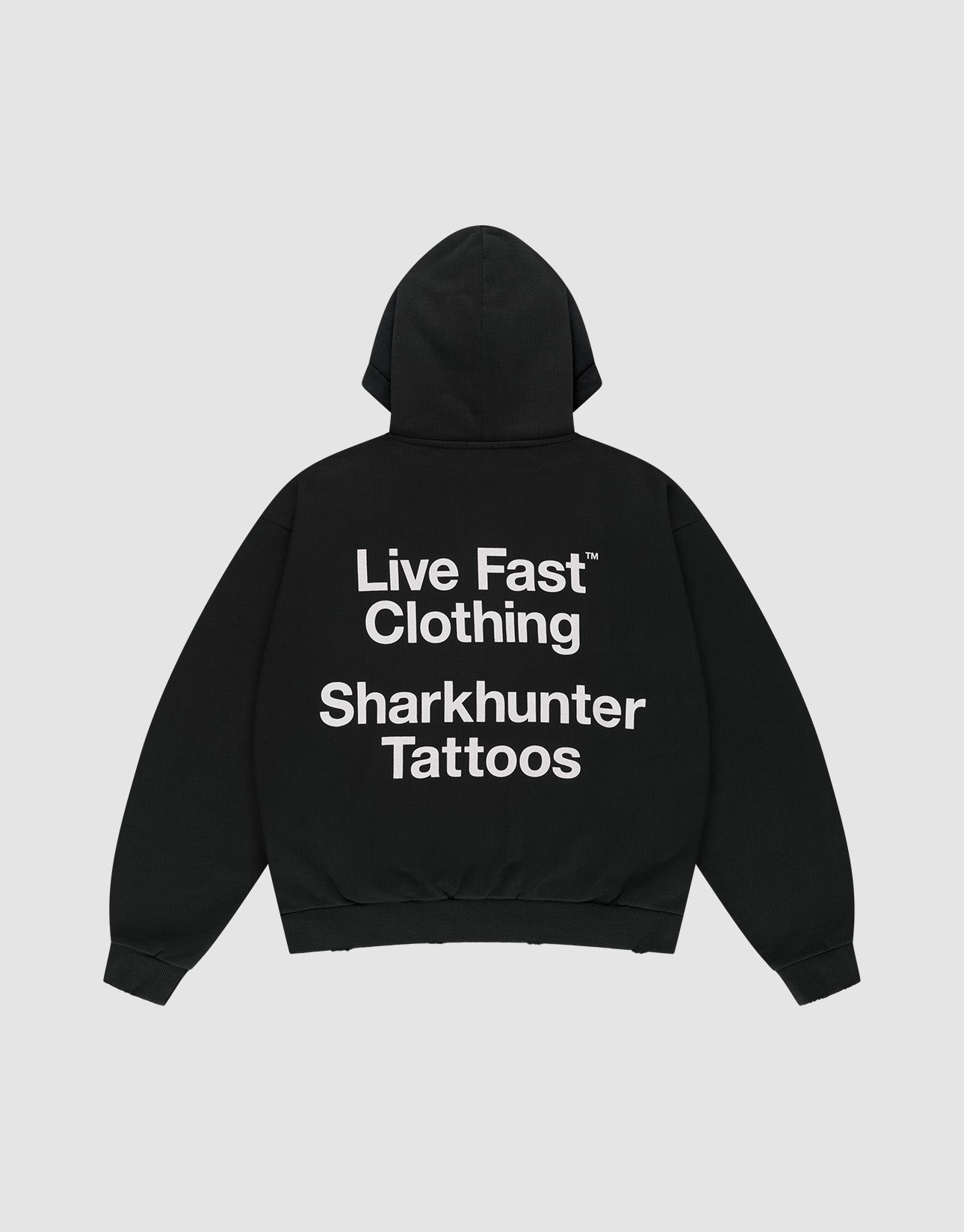 The LFDY Sharkhunter Hooded by LIVE FAST DIE YOUNG is a black oversized cotton hoodie with the hood up, shown flat on a light background. A large white back print reads: Live Fast Clothing Sharkhunter Tattoos.