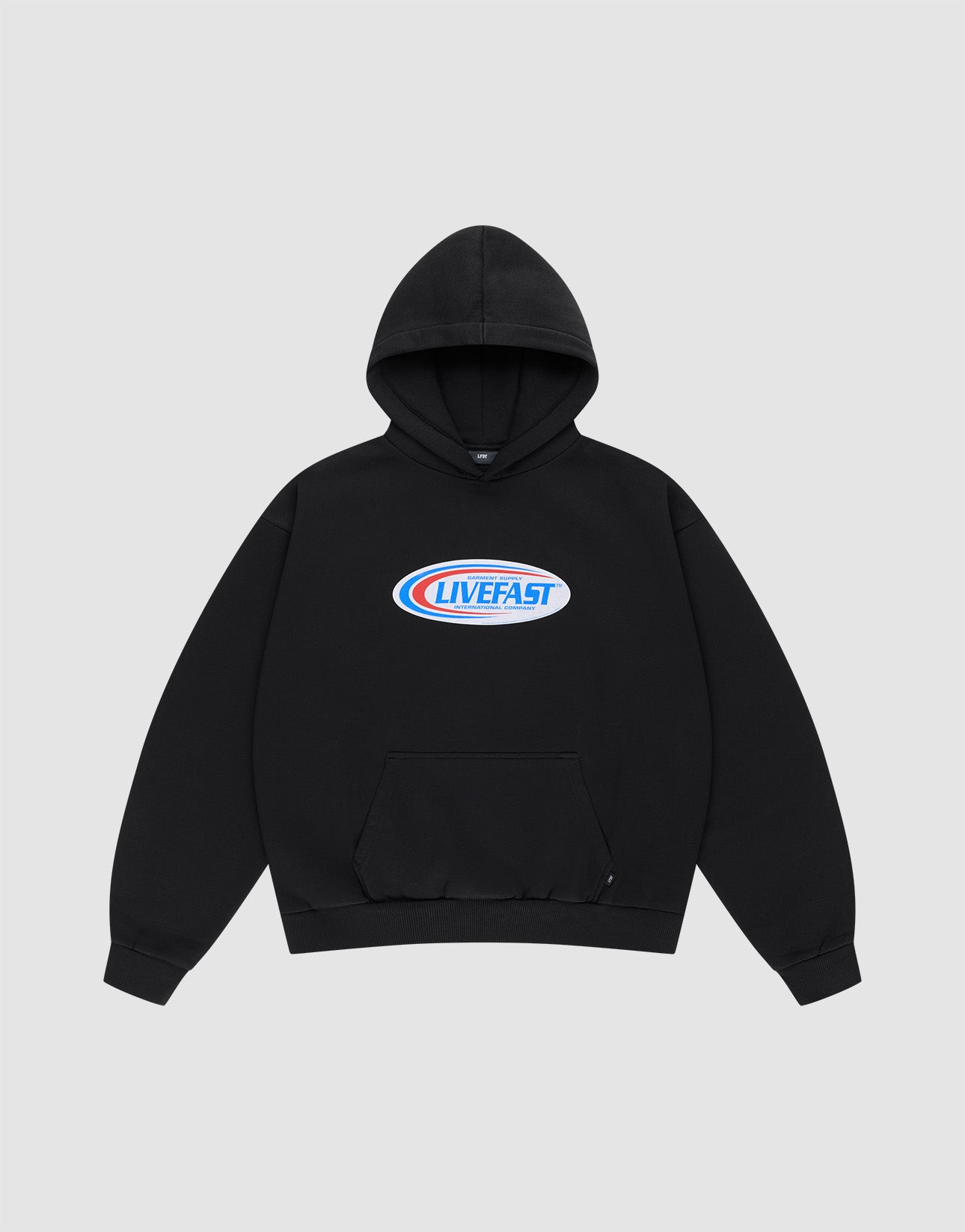 The Live Fast Garment Hooded by LIVE FAST DIE YOUNG is an oversized black hoodie with a front pocket and a blue/red oval "LIVE FAST" chest logo. Made from soft Baumwolle. Background: light gray. | plain