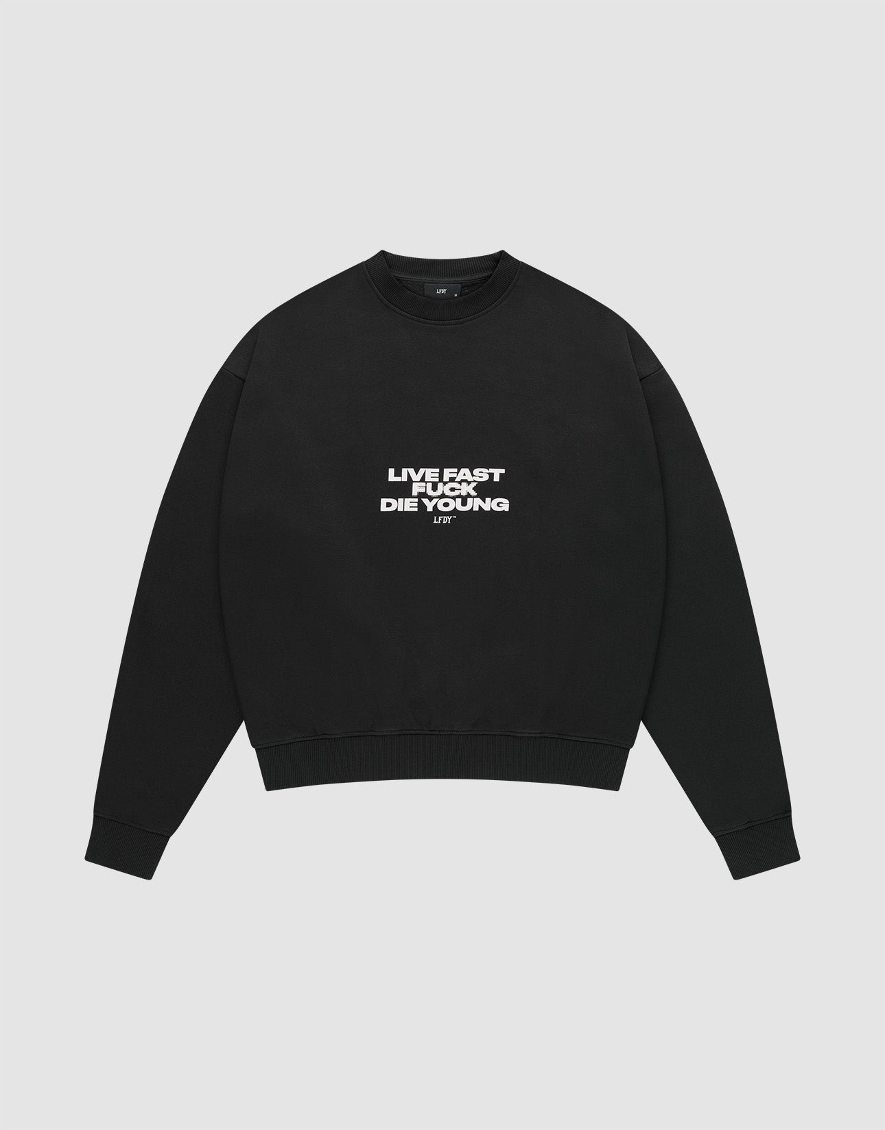 The Fuck Die Young Sweater by LIVE FAST DIE YOUNG is a black oversized crewneck in a soft cotton-poly blend, with white "LIVE FAST LIVE YOUNG DIE YOUNG" text on the chest, shown laid flat on a light gray background. | plain