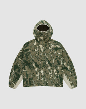 The Live Fast Teddy Jacket by LIVE FAST DIE YOUNG features a hood with visor opening, green/beige/white camouflage pattern, front zipper, and white panels on the lower sleeve sides, shown against a plain light gray background. | plain