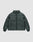 The LFDY Puffer Jacket by LIVE FAST DIE YOUNG is a dark green, oversized jacket with a high collar, front zipper, side pockets, and elastic cuffs, shown against a plain light grey background.