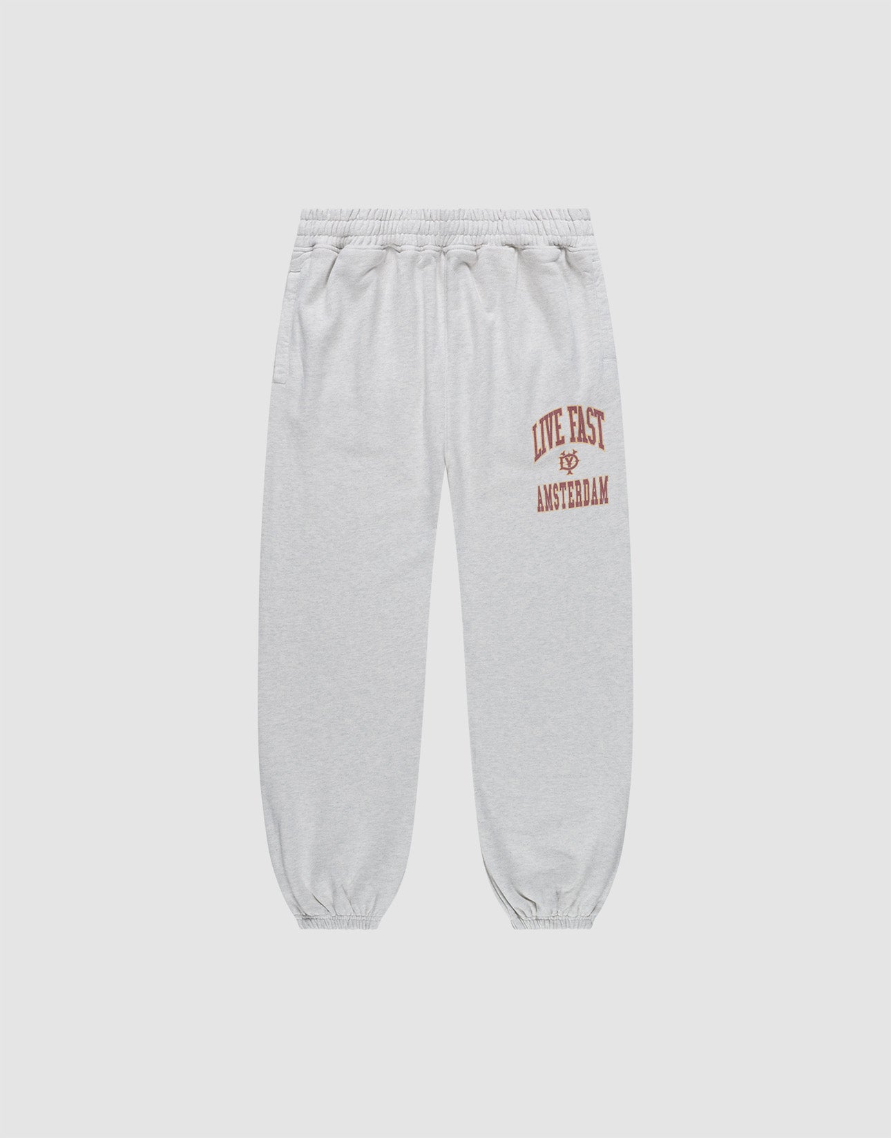 The Live Fast Amsterdam Loose Jogger by LIVE FAST DIE YOUNG features light gray, loose-fit 100% cotton sweatpants with a wide elastic waistband, cuffs, and bold red "LIVE FAST" lettering plus graphic prints on the left thigh for all-day comfort.
