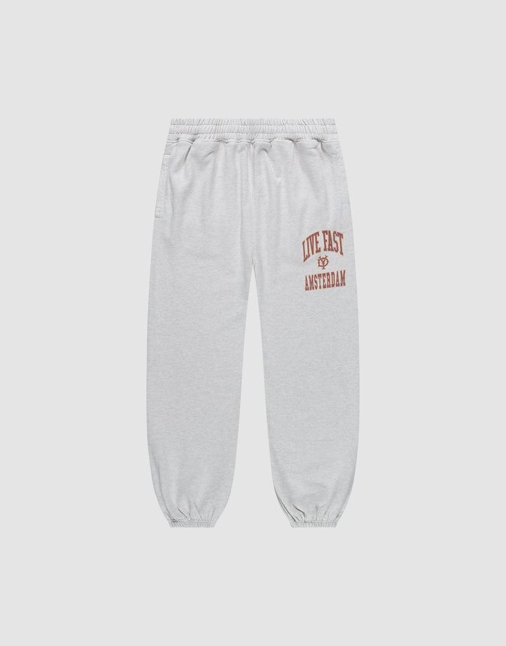 The Live Fast Amsterdam Loose Jogger by LIVE FAST DIE YOUNG features light gray, loose-fit 100% cotton sweatpants with a wide elastic waistband, cuffs, and bold red "LIVE FAST" lettering plus graphic prints on the left thigh for all-day comfort. | plain