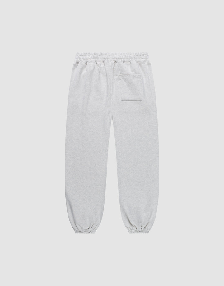 The Live Fast Amsterdam Loose Jogger by LIVE FAST DIE YOUNG features light gray 100% Baumwolle fabric, a wide elastic waistband, elastic ankle cuffs, and a single back pocket—shown on a plain white background.