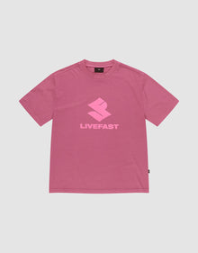 The LIVE FAST DIE YOUNG Live Fast LF Tee is a pink oversized short-sleeve t-shirt with a light pink geometric "LIVEFAST" logo, crafted from 100% Baumwolle, shown on a plain light gray background. | plain