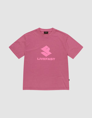 The LIVE FAST DIE YOUNG Live Fast LF Tee is a pink oversized short-sleeve t-shirt with a light pink geometric "LIVEFAST" logo, crafted from 100% Baumwolle, shown on a plain light gray background. | plain