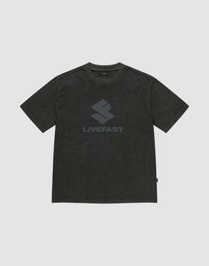 The Live Fast LF Tee by LIVE FAST DIE YOUNG is a black oversized short-sleeve shirt in 100% cotton, featuring a bold geometric front print and "LIVEFAST" in dark gray on the chest, shown against a plain light gray background. | plain