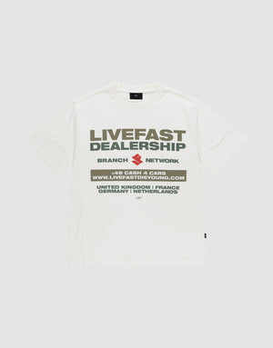The LFDY Network Tee by LIVE FAST DIE YOUNG is an oversized white t-shirt with a bold "LIVEFAST DEALERSHIP" and "BRANCH NETWORK" front print above a web address and country list, made from 100% cotton for comfort and style. | plain