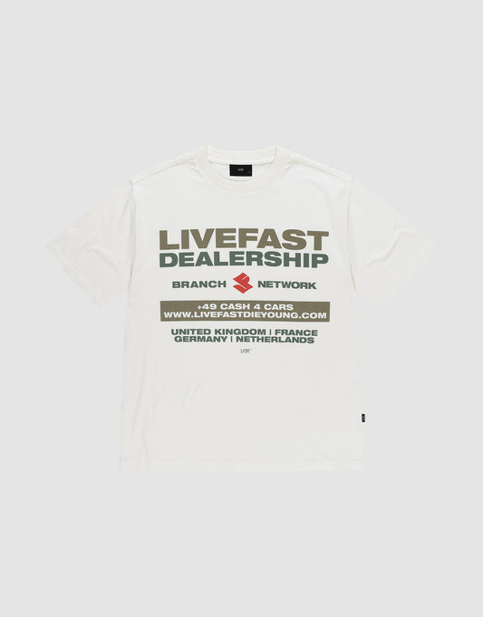 The LFDY Network Tee by LIVE FAST DIE YOUNG is an oversized white t-shirt with a bold "LIVEFAST DEALERSHIP" and "BRANCH NETWORK" front print above a web address and country list, made from 100% cotton for comfort and style. | plain