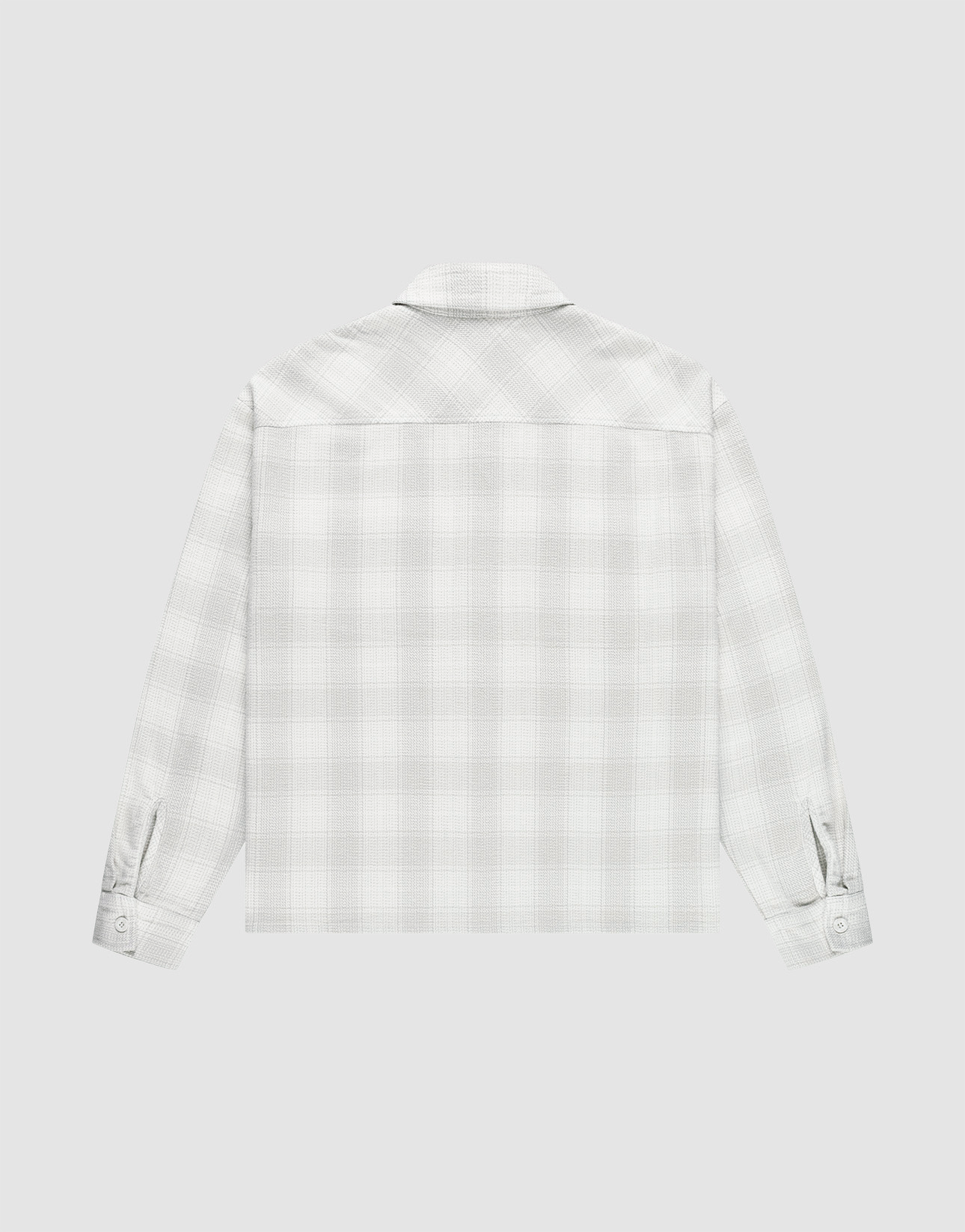 A back view of the LIVE FAST DIE YOUNG Vintage Flannel in light gray and white plaid, featuring an oversize fit and buttoned cuffs, displayed against a plain white background.