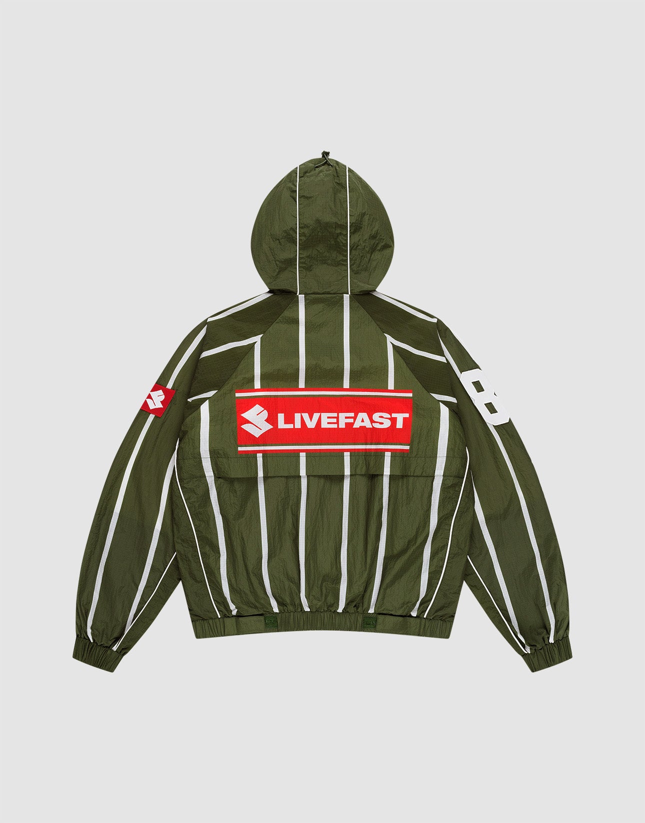 The LFDY Nylon Trackjacket by LIVE FAST DIE YOUNG is a green oversized jacket with a hood featuring an elastic drawstring, white vertical stripes, a bold red and white LIVEFAST backprint, "82" on the right sleeve, and a small red logo on the left.