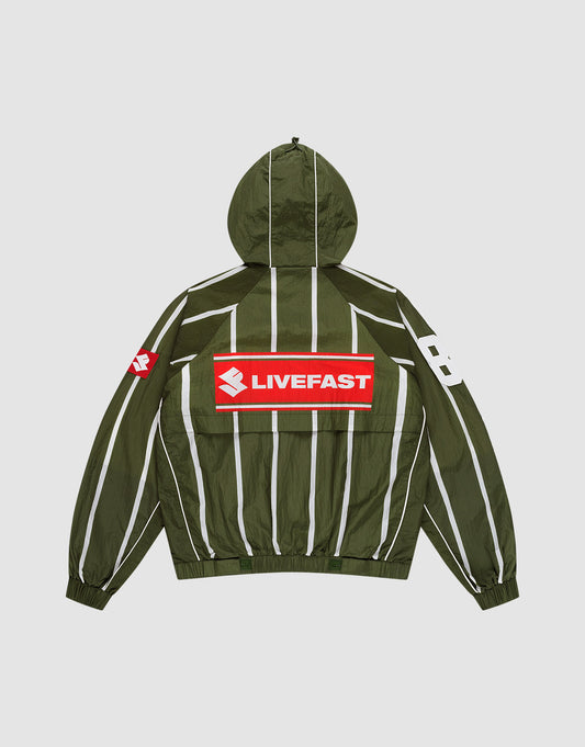 The LFDY Nylon Trackjacket by LIVE FAST DIE YOUNG is a green oversized jacket with a hood featuring an elastic drawstring, white vertical stripes, a bold red and white LIVEFAST backprint, "82" on the right sleeve, and a small red logo on the left. | plain