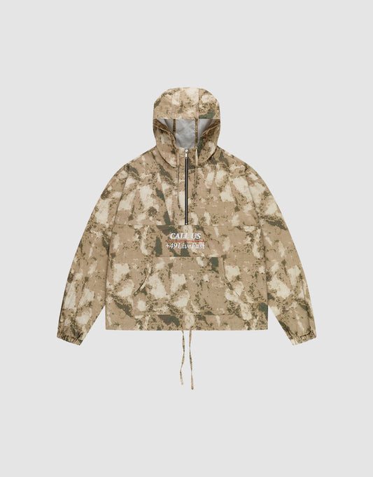The LFDY Camo Halfzip Jacket by LIVE FAST DIE YOUNG is an oversized beige and brown camouflage hooded jacket, made from 100% Baumwolle, featuring a front pocket, drawstring hem, and "CALL US WILDNESS" in white on the chest. | plain