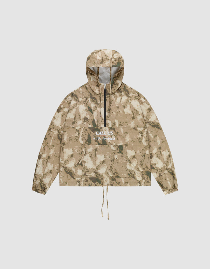 The LFDY Camo Halfzip Jacket by LIVE FAST DIE YOUNG is an oversized beige and brown camouflage hooded jacket, made from 100% Baumwolle, featuring a front pocket, drawstring hem, and "CALL US WILDNESS" in white on the chest. | plain