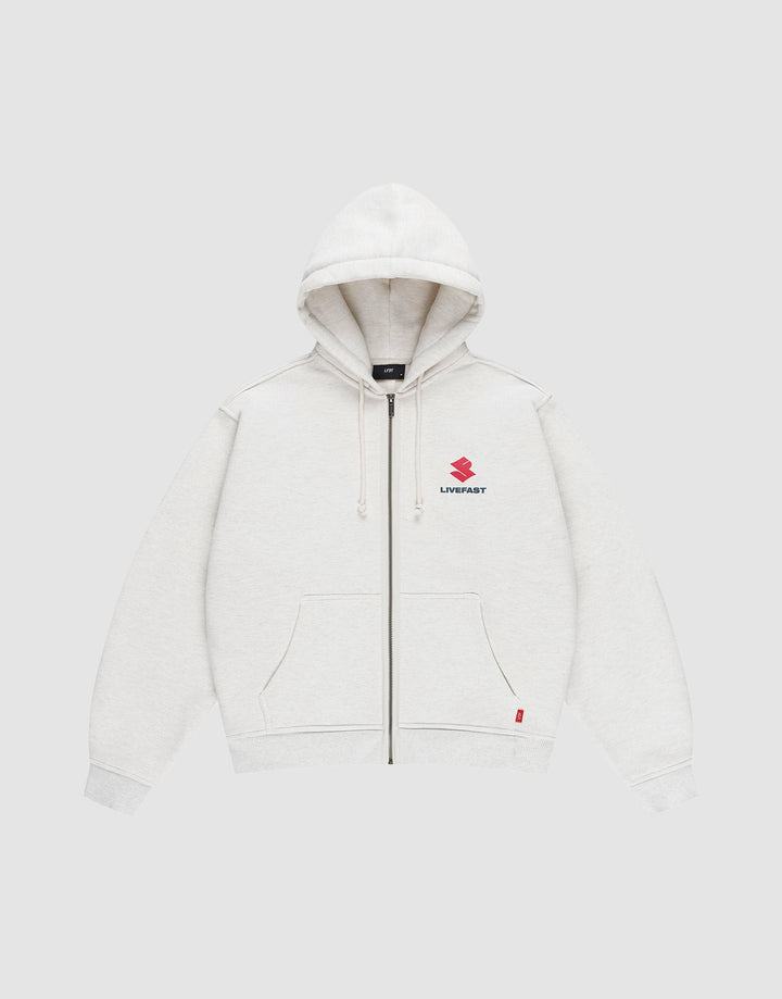 The LFDY Heavyweight Lounge Zip Hooded by LIVE FAST DIE YOUNG is a light gray, 100% Baumwolle zip-hoodie with front pockets, hood and drawstrings, minimalist design, and a small red Suzuki logo plus "LIVE FAST" on the left chest. Regular fit. | plain