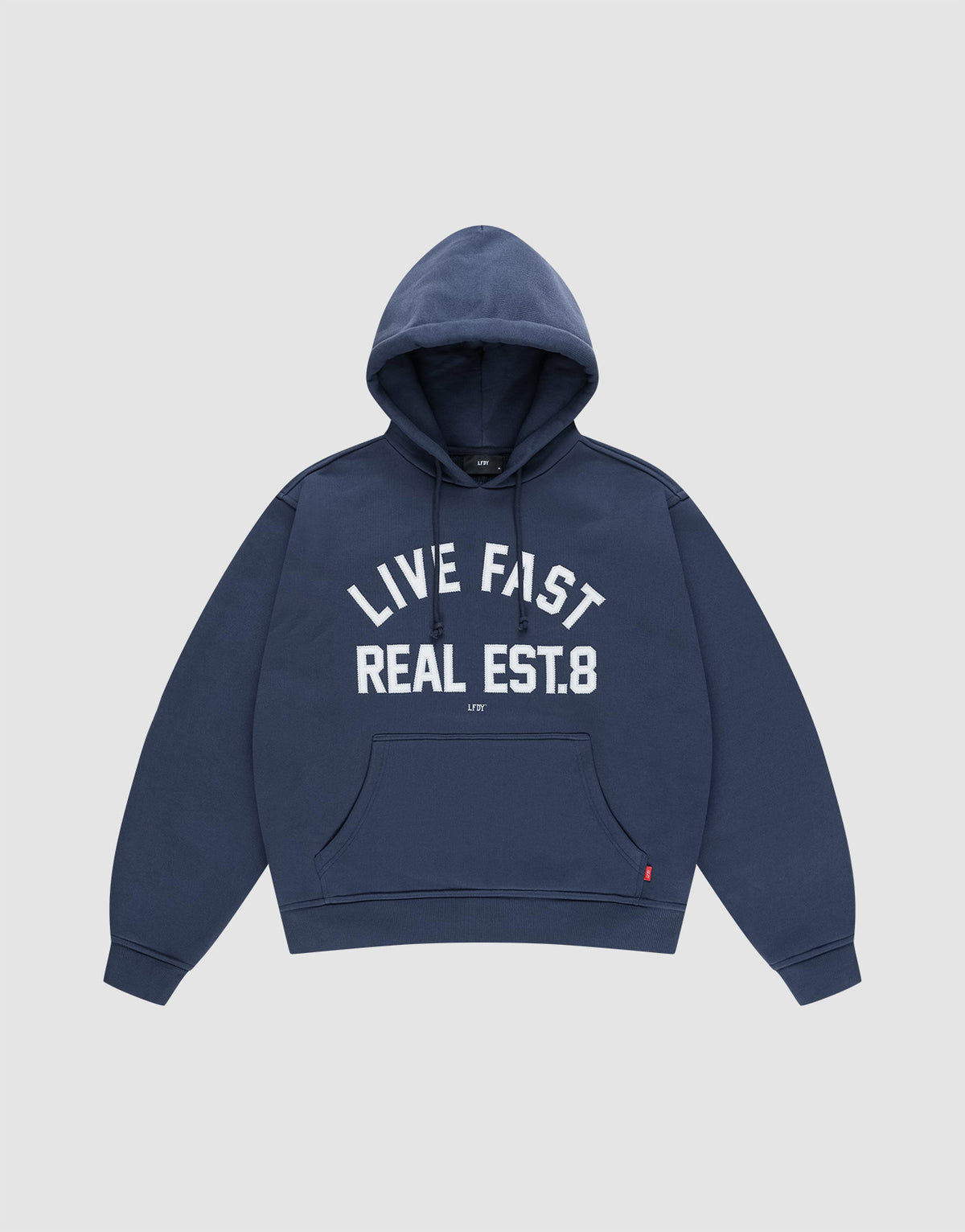 The LFDY Heavyweight Lounge Hooded by LIVE FAST DIE YOUNG is a navy blue regular-fit hoodie made from 100% Baumwolle, featuring a front pocket and "LIVE FAST REAL EST.8" in bold white letters across the chest. | plain