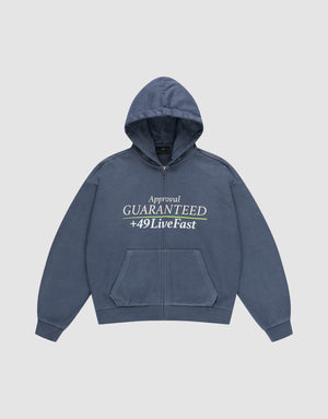 The LFDY Guaranteed Hooded Zip by LIVE FAST DIE YOUNG is a blue oversized zip-up hoodie with front pockets, featuring a bold front print reading "Approval GUARANTEED +49LiveFast," and made from 100% Baumwolle for comfort. | plain