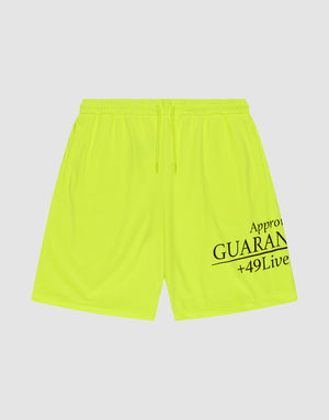 The LFDY Guaranteed Mesh Shorts by LIVE FAST DIE YOUNG are neon yellow polyester athletic shorts with an elastic waistband, drawstring, and black "Approv GUARAN +49Live" text on the lower right leg. Wide fit shown on a white background. | plain