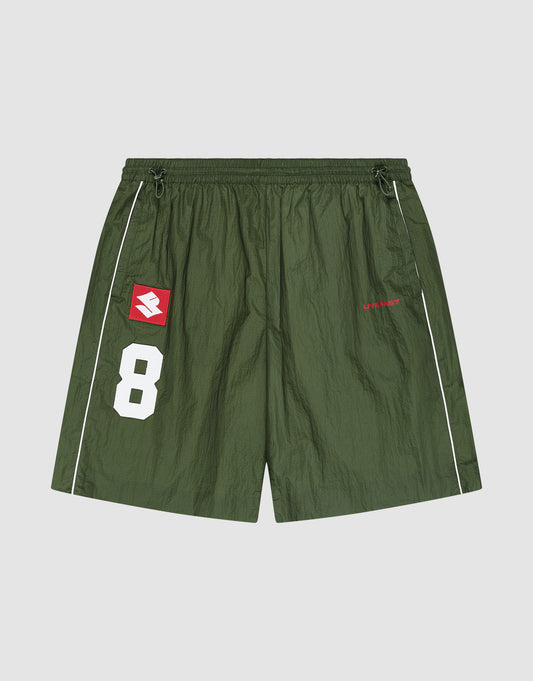 The LFDY Nylon Trackshorts by LIVE FAST DIE YOUNG feature a wide fit, elastic waistband, green polyamid fabric, white piping, number 8 and logo patch, plus bold red "LIBERTY" text on the right leg for sporty style and active comfort. | plain