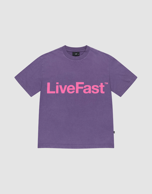 The Basic OS Livefast Tee by LIVE FAST DIE YOUNG is a purple t-shirt with a bold Frontprint: LiveFast™ in large pink letters. Made from 100% Baumwolle, it features short sleeves and a round neckline for all-day comfort. | plain