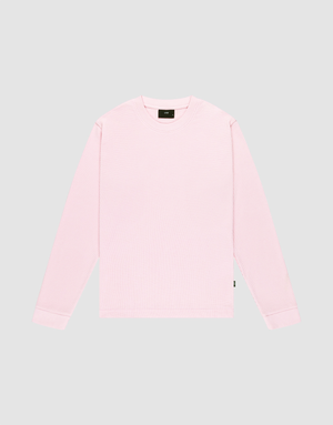 The LIVE FAST DIE YOUNG Basic Waffle Longsleeve, shown in light pink with an oversized fit, is made from a soft Baumwolle Polyester blend and features a simple crewneck design on a plain light gray background. No visible patterns or logos. | plain