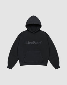 The Basic Livefast Hooded by LIVE FAST DIE YOUNG is an oversized black hoodie featuring a subtle "LiveFast" front print, crafted from soft cotton and shown against a plain light gray background. | plain
