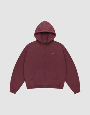 The Basic Hooded Zip by LIVE FAST DIE YOUNG is a maroon zip-up hoodie with a hood, front pockets, and small white LFDY branding on the left chest, shown on a plain light gray background. | plain