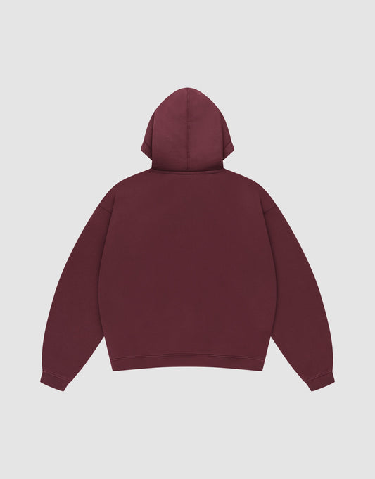 A Basic Hooded Zip by LIVE FAST DIE YOUNG in plain maroon is laid flat, back facing up, with long sleeves, a hood, and no visible logos or designs on a light gray background.