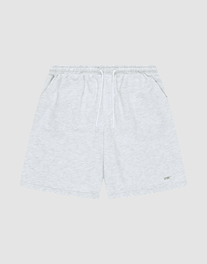 LIVE FAST DIE YOUNG Basic Shorts in light gray feature a logo-print on the lower left leg, elastic waistband with white drawstring, side pockets, and a regular fit. Displayed on a plain gray background. | plain