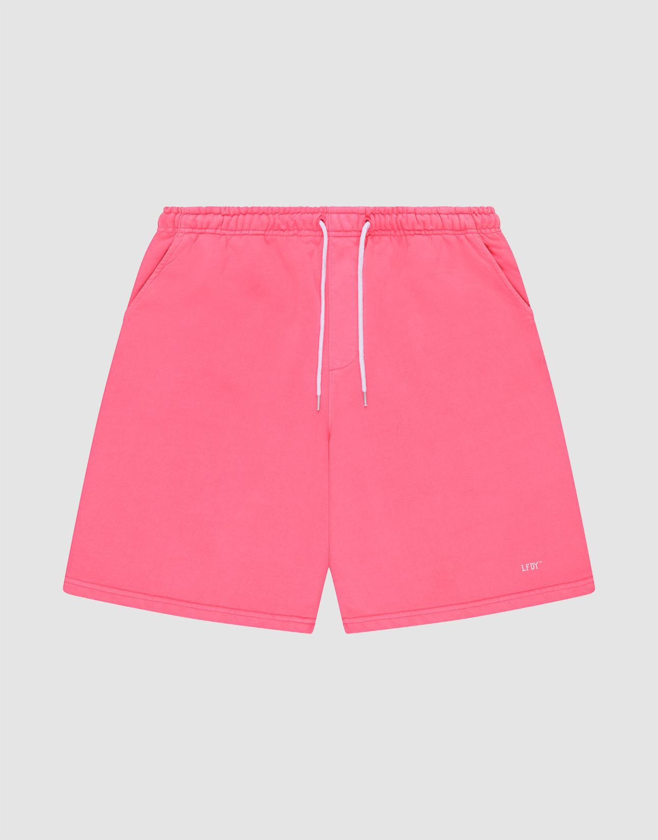 LIVE FAST DIE YOUNG Basic Shorts in bright pink feature an elastic waistband, white drawstrings, side pockets, and a small white “LUFT” logo near the hem, displayed flat on a light gray background for a sporty look.