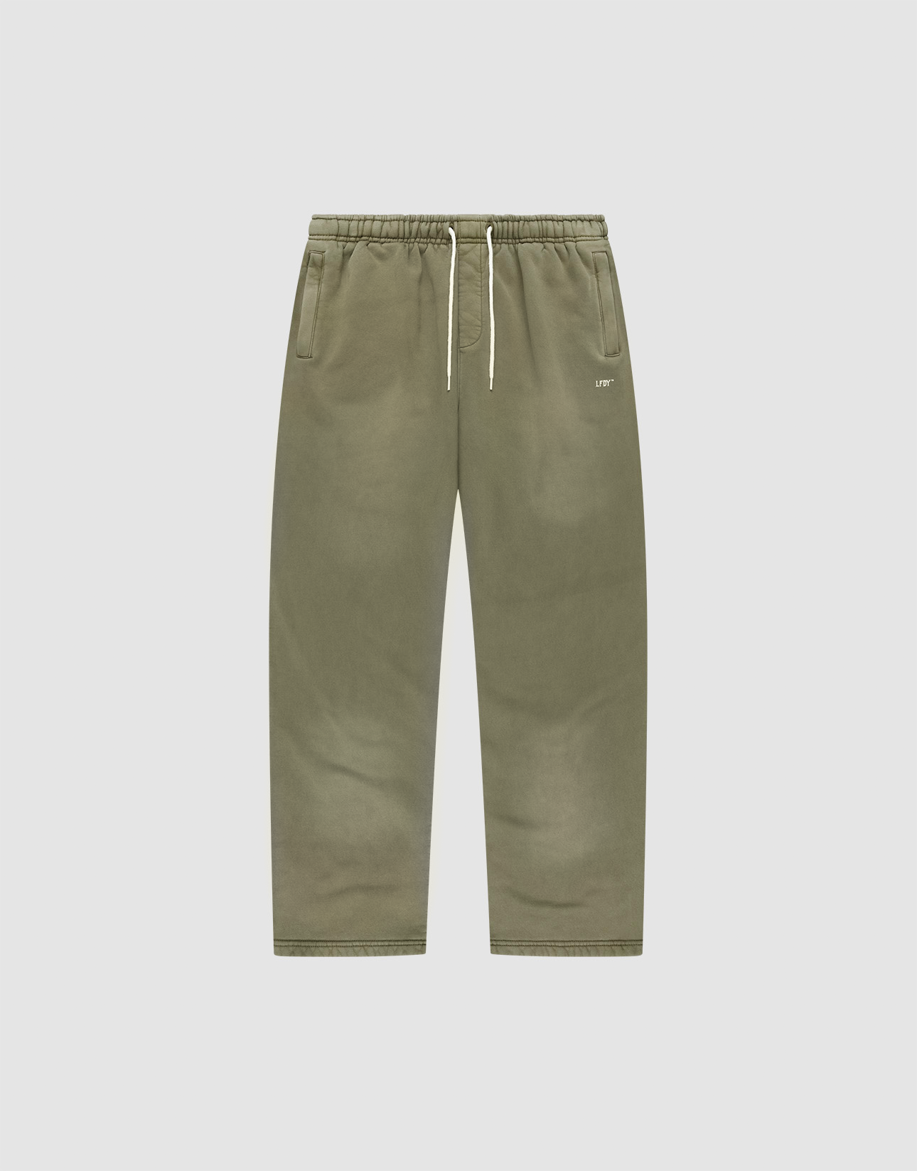 The Basic Wide Jogger by LIVE FAST DIE YOUNG features an olive green wide fit, elastic waistband, white drawstring, side pockets, and a minimal logo on the left pocket. Shown on a plain white background for a clean presentation.
