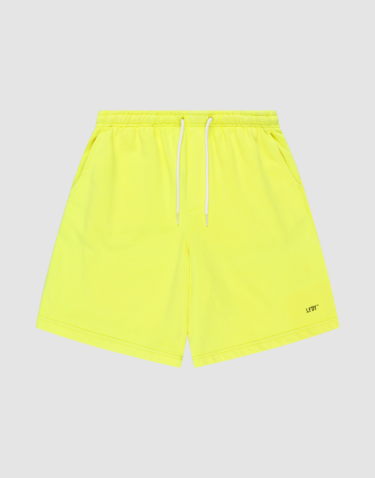 Basic Shorts by LIVE FAST DIE YOUNG in neon yellow, feature an elastischer Bund, white drawstring, side pockets, regular fit, and a small LFTD logo-print near the hem. Displayed on a light grey background.