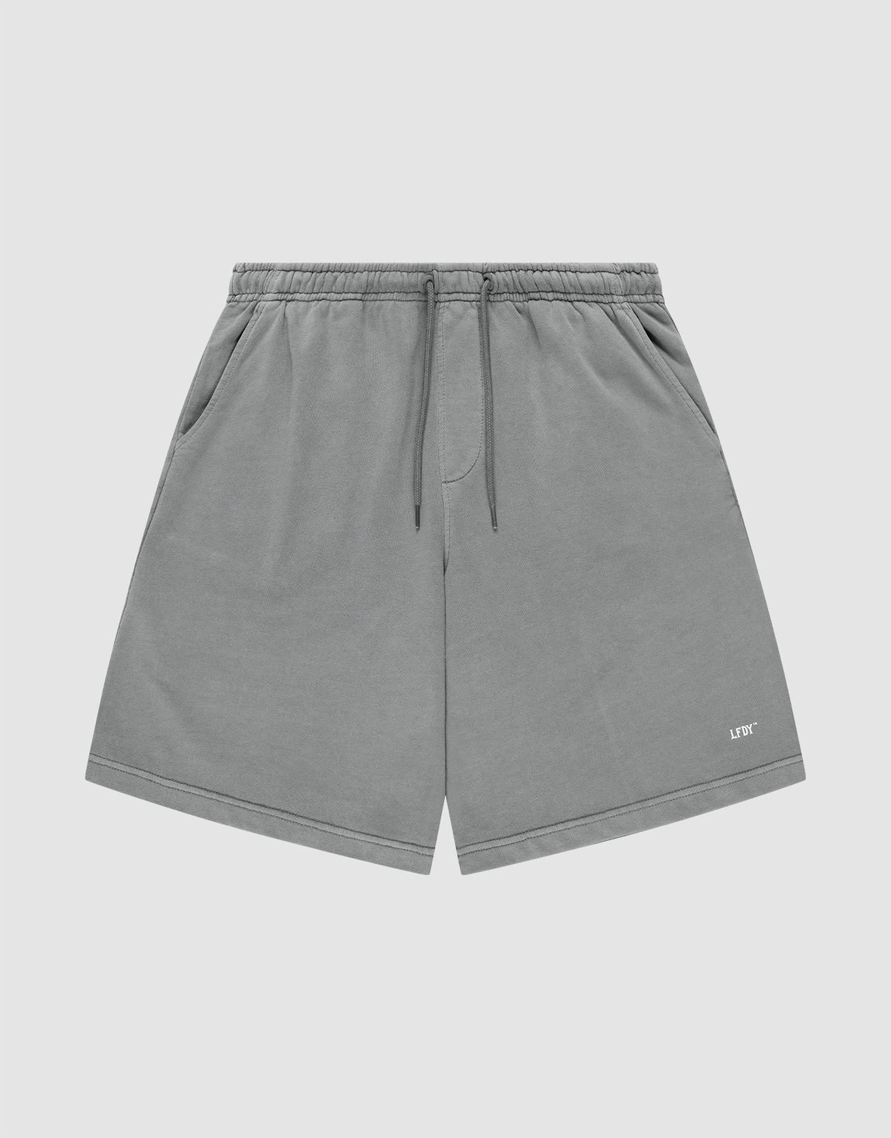 LIVE FAST DIE YOUNG Basic Shorts in gray with a faded finish feature an elastic waistband, side pockets, and a small white LIFY logo on the lower left leg, shown against a plain light background.