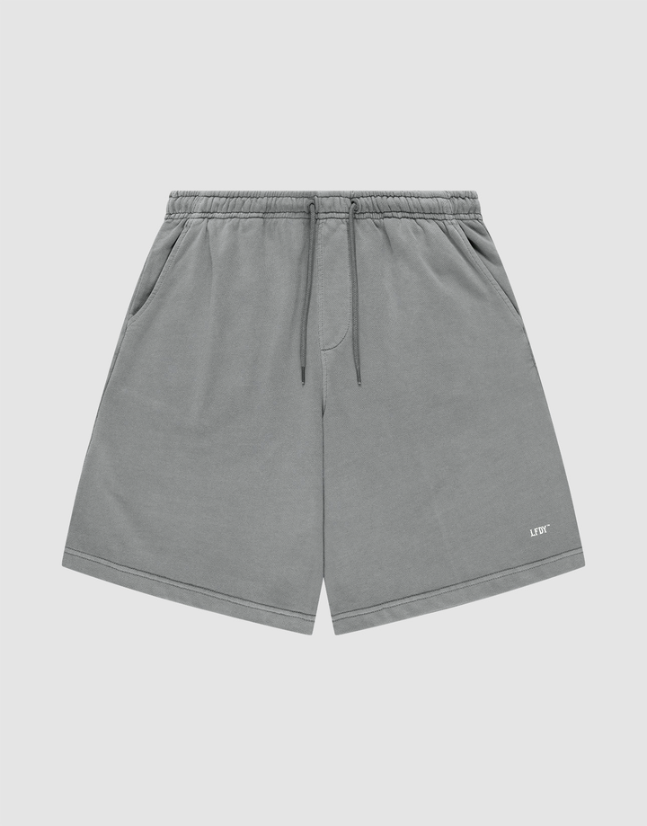 LIVE FAST DIE YOUNG Basic Shorts in gray with a faded finish feature an elastic waistband, side pockets, and a small white LIFY logo on the lower left leg, shown against a plain light background. | plain