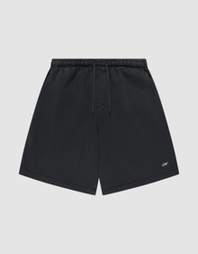 Basic Shorts by LIVE FAST DIE YOUNG in black, featuring an elastic waistband, side pockets, and a small white logo print on the lower left leg, shown against a plain light gray background. | plain