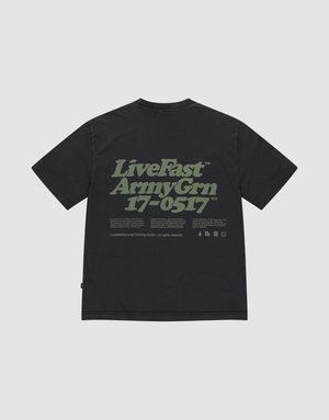 The LIVE FAST DIE YOUNG Basic 210 Tee is a black oversize fit shirt in 100% Baumwolle, featuring large green “LiveFast ArmyGrn 17-0517” text on the back plus extra small front and back prints with symbols. | plain